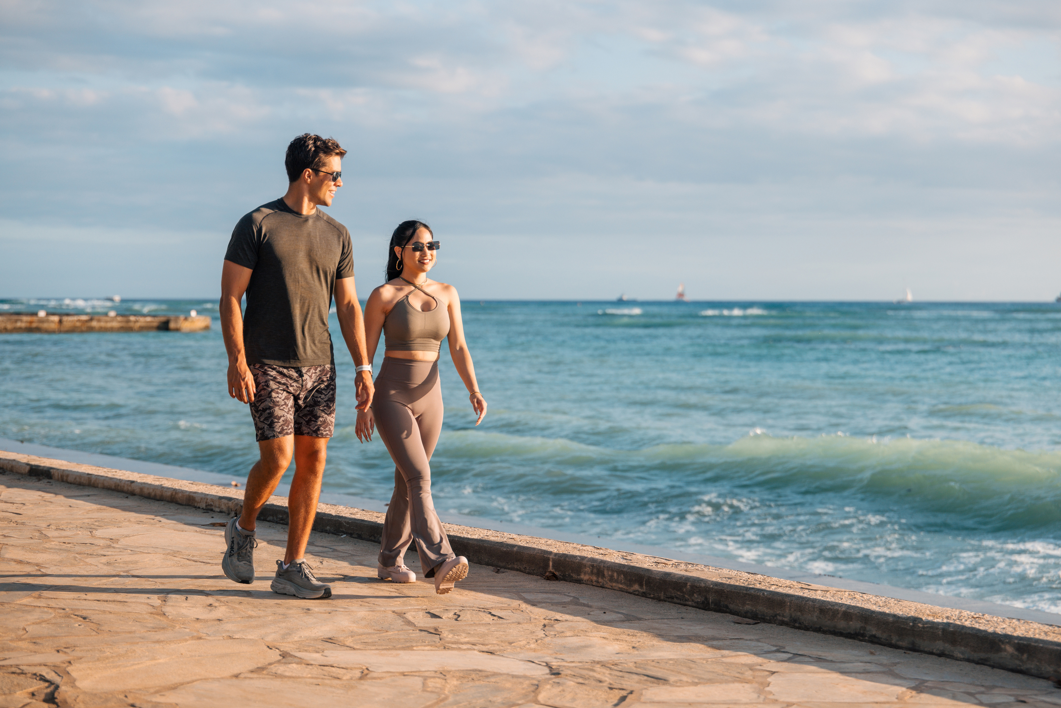 couple walking by the beach