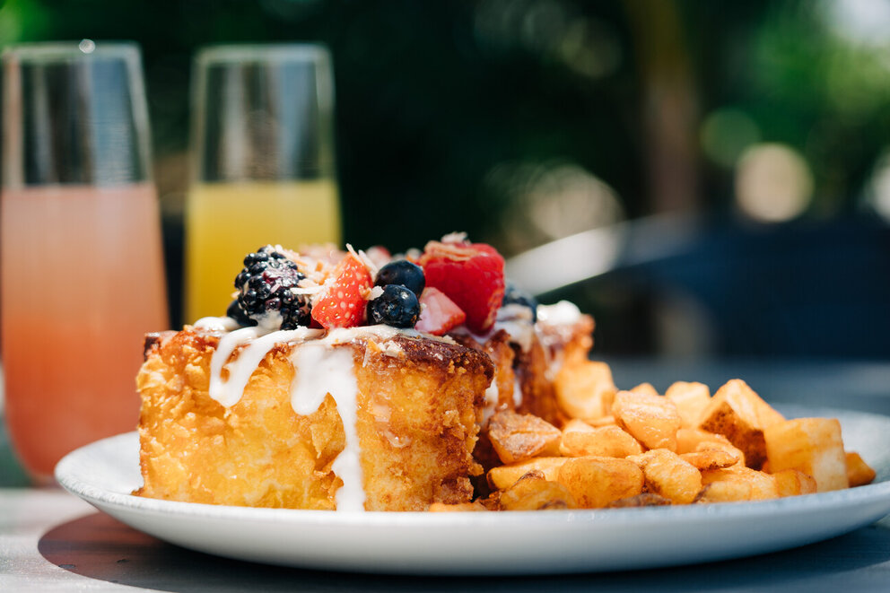 Plate of food topped with Fruit