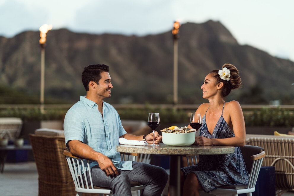 Couple Sitting at Table Outside