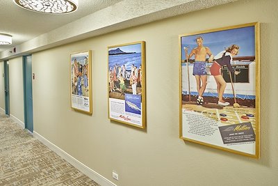 Hallway of Artwork in Queen Kapiolani Hotel